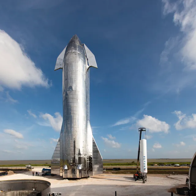 SpaceX’s Starship Mk1 prototype stands alongside a first stage of SpaceX’s Falcon 1 rocket